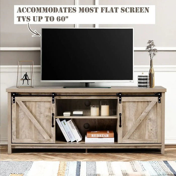 Sliding barn door TV stand in rustic wood with decor, holding a flat screen TV up to 60 inches