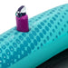 Blue inflatable pool lounger with polka dot pattern and built-in cup holder holding a bottle