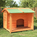 Solid pine wood dog kennel with green roof in a grassy backyard setting