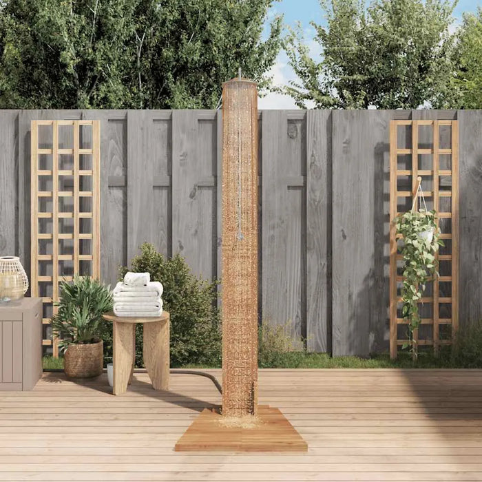 Solid teak outdoor garden shower with wood deck, towel table, and plants
