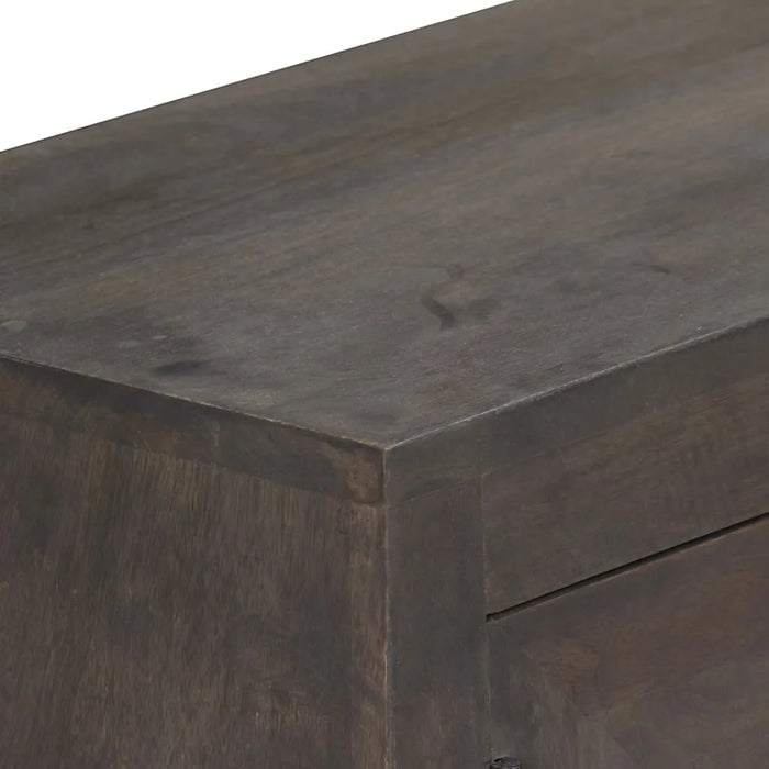 Close-up of dark wooden furniture corner showing smooth grain and finish