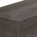 Close-up of dark wooden furniture corner showing smooth grain and finish
