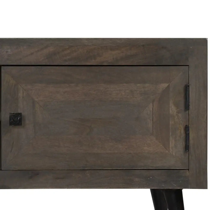 Dark wood cabinet door with square black handle and black hinges, part of wooden furniture