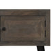 Dark wood cabinet door with square black handle and black hinges, part of wooden furniture