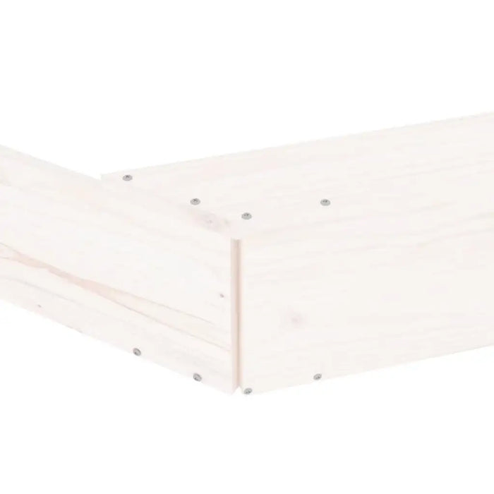 Close-up of square wooden sandbox corner with white finish and visible metal screws