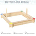Square wooden sandbox with bottomless design, colored corner seats, and two upright posts.