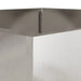 Close-up of silver stainless steel garden planter corner with smooth brushed texture