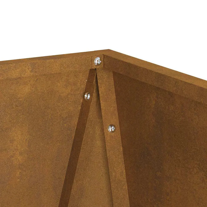 Close-up of rust-colored weathering steel corner joint with bolts of outdoor planter box