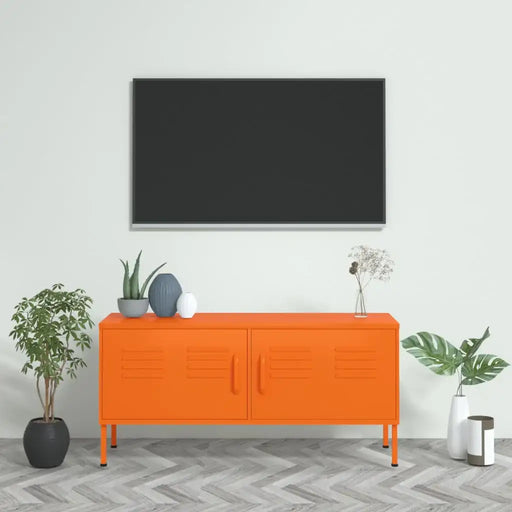 Bright orange steel TV cabinet with storage doors in modern living room, decorated with plants and vases