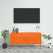 Bright orange steel TV cabinet with storage doors in modern living room, decorated with plants and vases