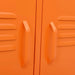 Close-up of bright orange steel TV cabinet doors with integrated handles and ventilation slats