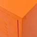 Close-up of orange steel TV cabinet corner with smooth finish and door edge