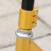 Gold stunt scooter 360 swivel clamp and steel-aluminum frame close-up outdoors