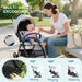 Woman sitting with a baby in a stroller, highlighting multi-angle ergonomic sitting features.