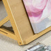 Beechwood tabletop easel with canvas and paint tubes on a textured surface
