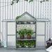 Three-tier grey wooden cold frame greenhouse with potted plants on adjustable shelves outdoors