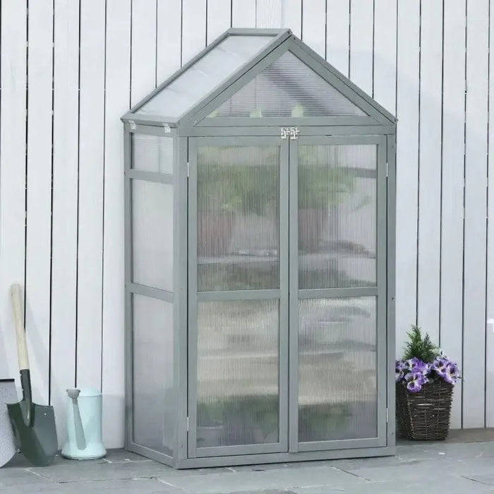 Three-tier grey wooden cold frame greenhouse mini grow house with adjustable shelves outdoors
