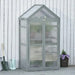 Three-tier grey wooden cold frame greenhouse mini grow house with adjustable shelves outdoors