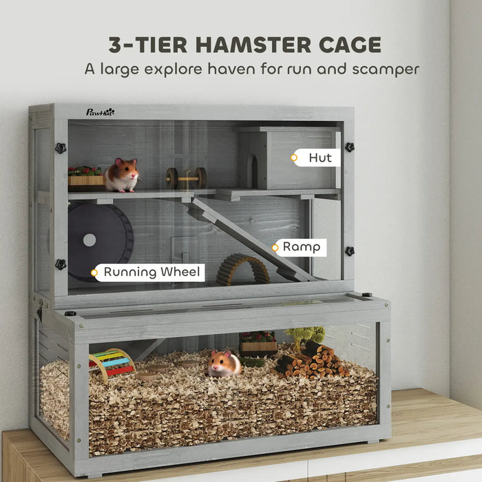 Three-tier grey wooden hamster cage with running wheel, ramp, hut, and hamster bedding