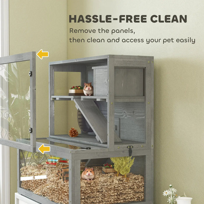 Three-tier grey wooden hamster cage with clear panels, hamster wheel, hut, wood shavings, and two hamsters