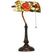 Decorative lamp with stained glass shade featuring a rose design on a white background
