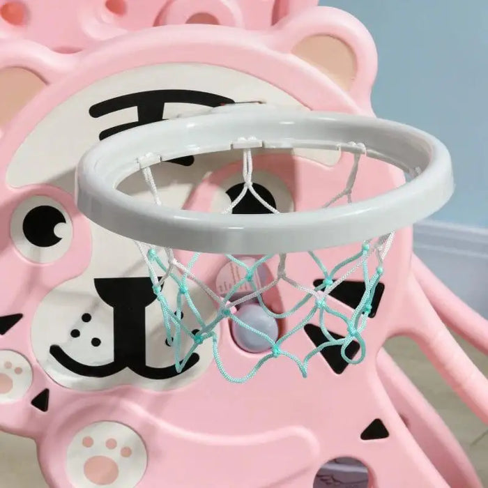Pink tiger-themed kids slide with basketball hoop for toddlers indoors