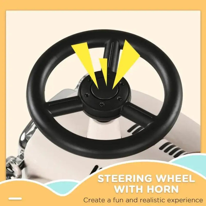 Close-up of toddler ride-on car steering wheel with horn on cream foot-to-floor toy vehicle