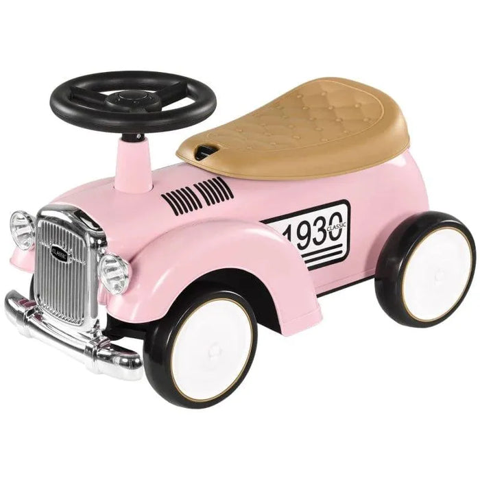 Pink toddler ride-on sliding car with steering wheel and tan seat, vintage style