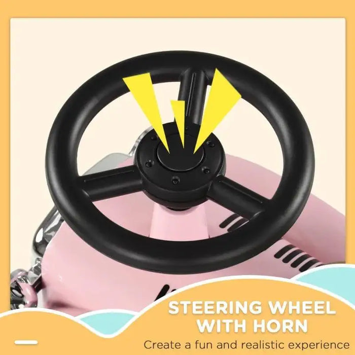 Black steering wheel with horn on pink toddler ride-on car, fun toy vehicle close-up