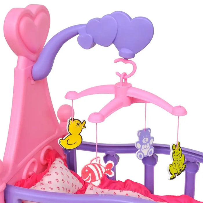 Pink and purple toy crib with mobile featuring duck, fish, bear, and frog for dolls