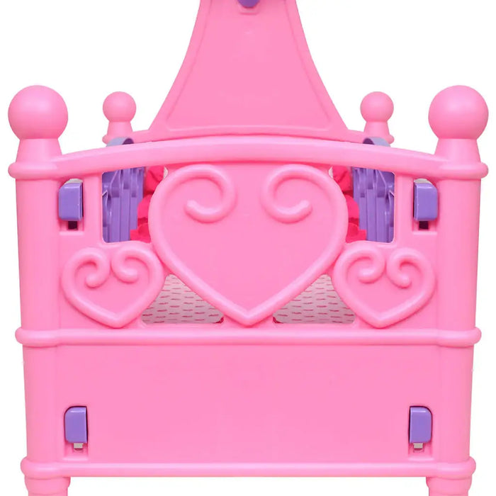 Pink plastic toy doll crib with heart designs and purple accents