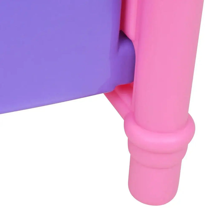 Close-up of pink and purple plastic children's furniture corner and leg