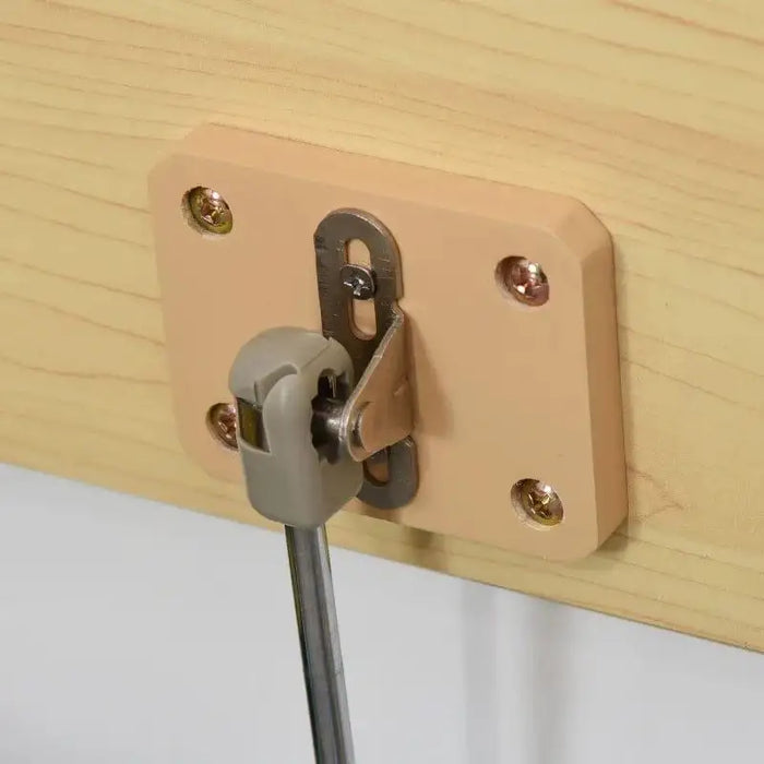 Close-up of safe gas hinge on wood panel for toy storage box bench