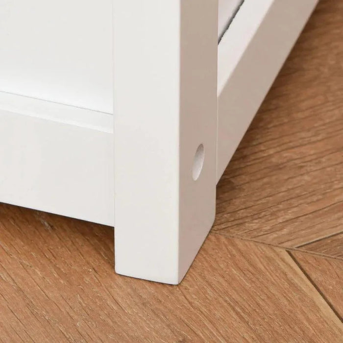 Close-up of white wooden toy storage box bench leg on wooden floor