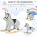 Grey and white striped plush rocking horse with wooden base, blue saddle, and rainbow background.