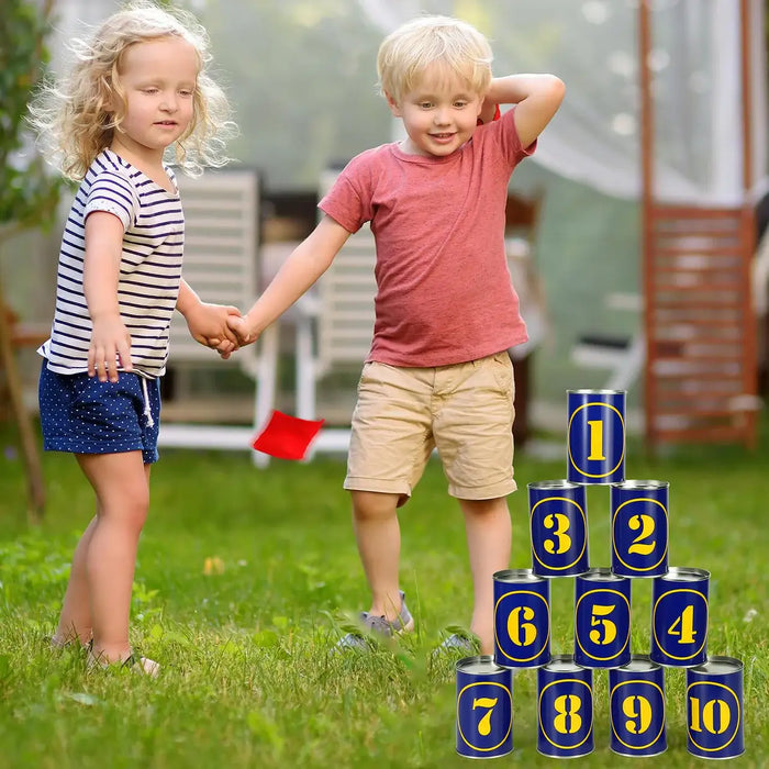 Kids playing traditional tin can alley carnival game outdoors with numbered cans and beanbags