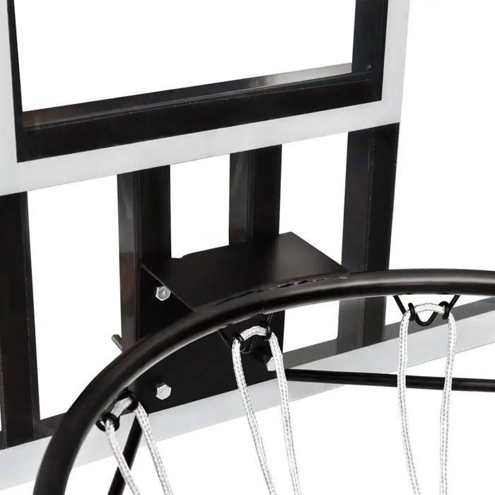 Close-up of transparent wall-mounted basketball backboard with steel rim and white net