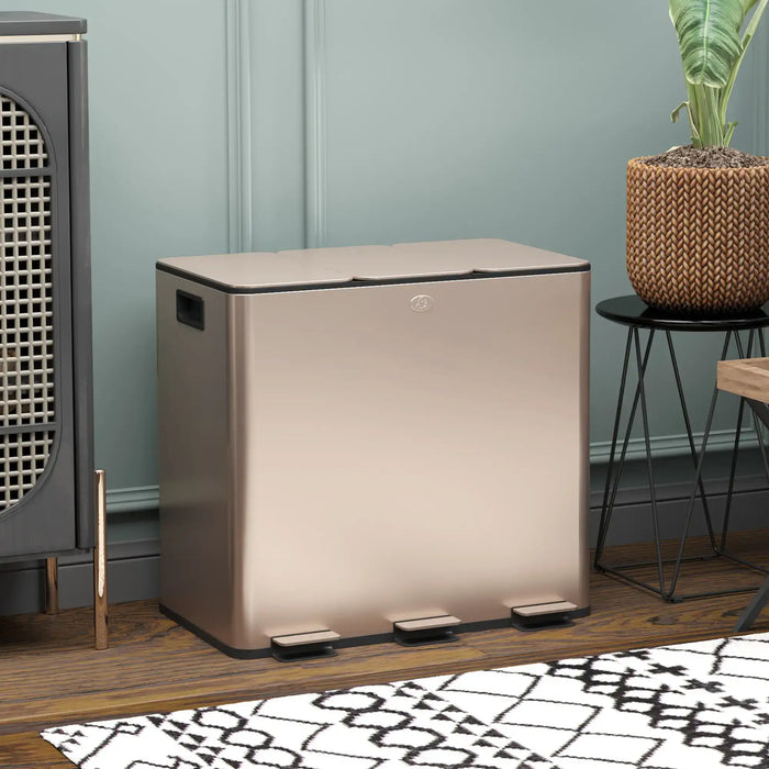Beige trash can on a wooden floor with a plant and decorative items in the background.