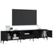 Black engineered wood TV cabinet with metal frame and open doors, holding books, clock, and decor