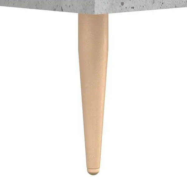 Close-up of a beige toy table leg with rounded end against a white background