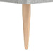 Close-up of a beige toy table leg with rounded end against a white background