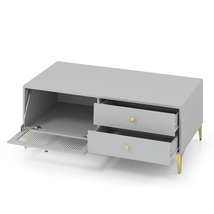 Light grey TV cabinet with two drawers, drop-down door with vent, and gold legs