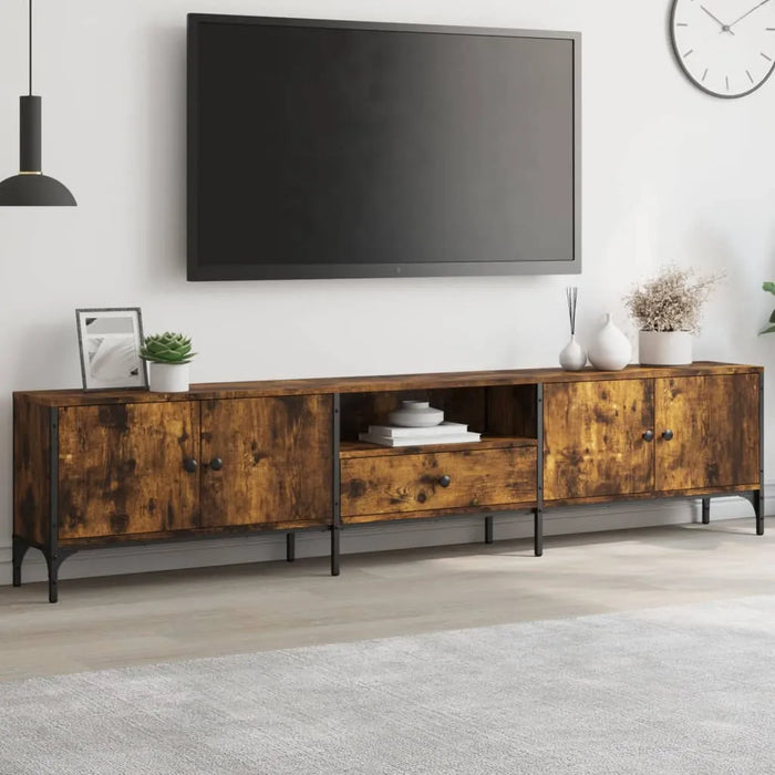 Modern smoked oak TV cabinet with metal frame under wall-mounted flat screen in stylish living room