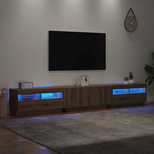 Modern artisan oak TV cabinet with RGB LED lights under floating wall-mounted flat screen in cozy living room