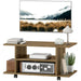 Walnut finish TV stand on wheels with open shelves holding decor and electronics