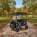 Cosway outdoor wagon in a park with trees and fallen leaves.