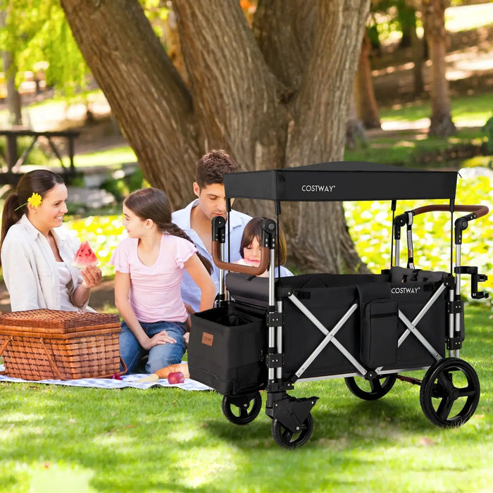 Family with a Costway wagon in a park setting