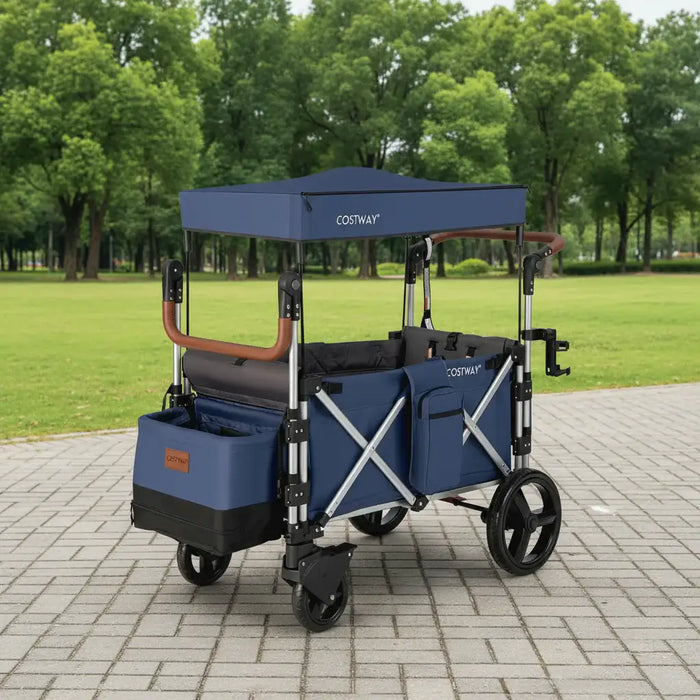 Blue and black stroller with canopy in a park setting