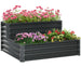 Two-tier galvanized steel raised garden bed planter with vibrant pink, purple, red flowers and green foliage