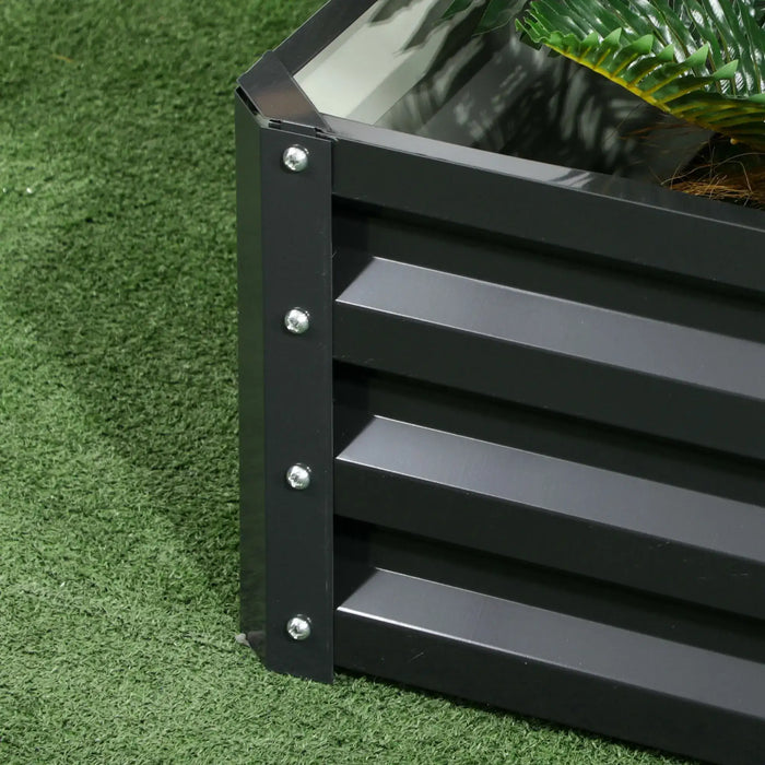 Corner detail of dark grey galvanized steel two-tier raised garden bed on green artificial grass